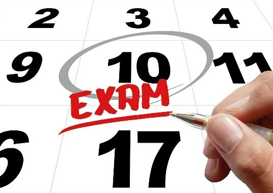 Calendar image with 'Exam' marked on 10th, related to the ChFEBC℠ designation renewal process for 2023.